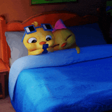 a couple of cartoon characters laying on a bed with one wearing sunglasses