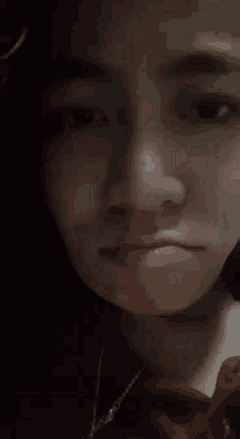 a close up of a person 's face making a funny face .