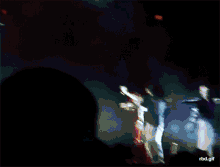 a blurry picture of a group of people on a stage with rbd.gif written on the bottom