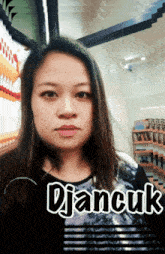 a woman with djancuk written on the bottom