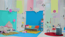 a pink flamingo float is being held by a girl in a room