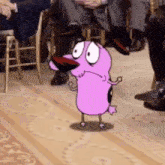 courage the cowardly dog from the cartoon courage the cowardly dog is standing on the floor