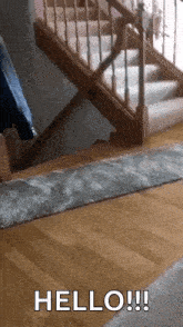 a staircase with a rug on the floor and the words hello written on the bottom
