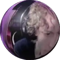 a purple ball with a statue of a woman in it