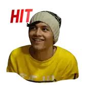 a young man wearing a beanie and a yellow shirt with the words hit and run above him