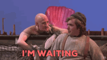 two men are standing next to each other with the words i 'm waiting on the bottom