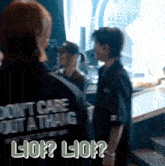 a man wearing a black shirt that says ' do n't care but a thing '