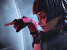 a woman wearing pink gloves is pointing her finger