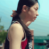 a woman in a basketball uniform has the number 25 on her jersey