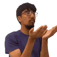 a man wearing glasses is clapping his hands