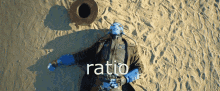 a man in a cowboy outfit is laying in the sand with the word ratio written above him