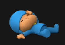 a cartoon character in a blue outfit is laying down