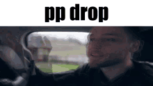 a man is driving a car and looking out the window with the words `` pp drop '' written above him .