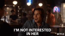 a man in a denim jacket says " i 'm not interested in her " in a netflix ad