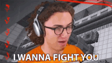a man wearing glasses and headphones says i wanna fight you
