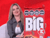 a woman is holding a box of big fan to che chips