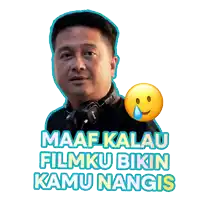 a man wearing headphones has a sticker that says maaf kalau filmku bikin kamu nangis