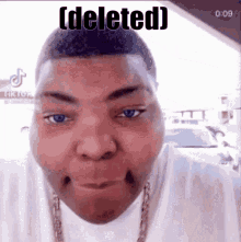 a close up of a man 's face with the words `` deleted '' written above him .