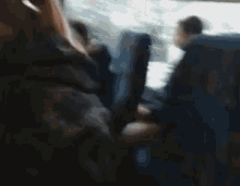 a close up of a woman 's face with her mouth open and her tongue hanging out .