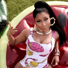 a woman wearing a swimsuit that says ' moschino ' on the front