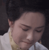 a close up of a woman 's face making a funny face .