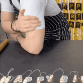 a person giving a thumbs up with a happy birthday banner in the background