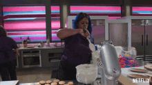 a netflix ad shows a woman preparing cupcakes