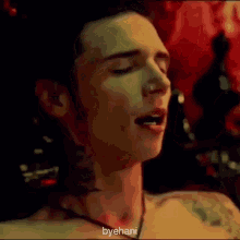 a close up of a person 's face with their eyes closed and a nose ring .