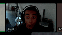a man wearing headphones is on a video call with dr. cecill