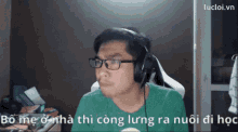 a man wearing glasses and headphones says lucloi.vn in the lower right corner