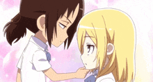 a couple of anime girls are touching each other 's faces and looking at each other .
