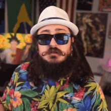a man with a beard and mustache wearing sunglasses and a hawaiian shirt