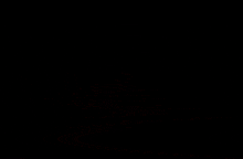 a woman in an orange jacket is smiling in the dark