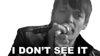 a man singing into a microphone with the words " i don 't see it " above him