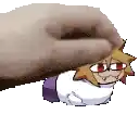 a hand is holding a cartoon character on a white surface .