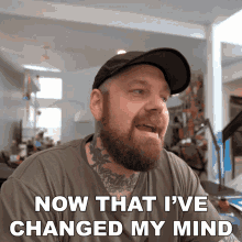 a man with a beard and hat is saying now that i 've changed my mind