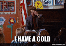 a man sitting in front of a group of children with the words " i have a cold " above him