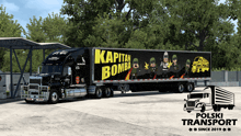 a mack semi truck with a captain bomba advertisement on the side