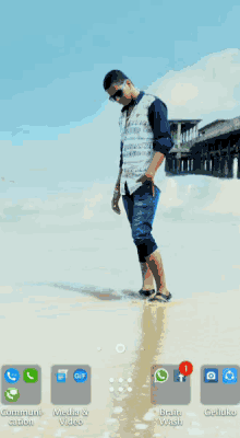 a phone screen shows icons for google calculator camera and gallery