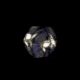 a cartoon character with a mask on his face and a purple wing on his back .