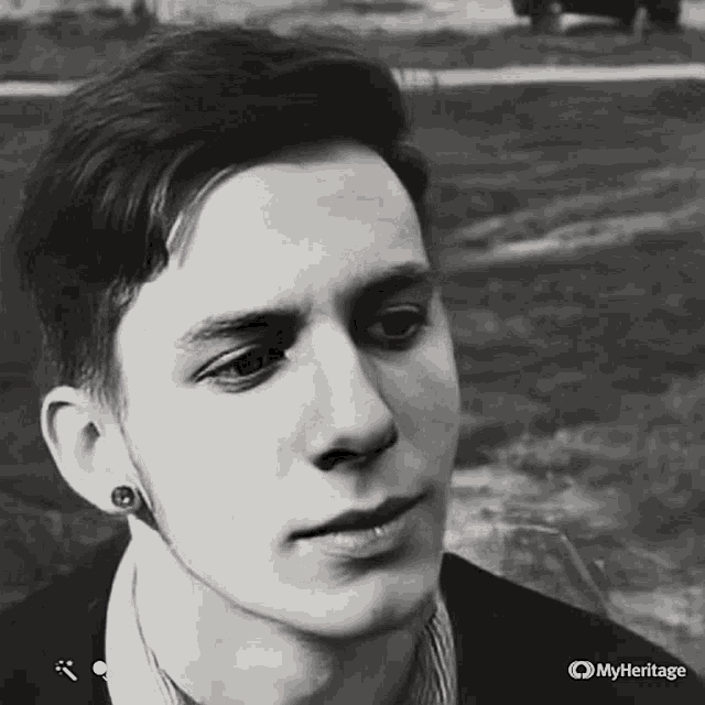 a close up of a man 's face with the words myheritage on the bottom right