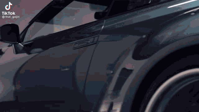 a close up of a car 's side with a tiktok logo on it