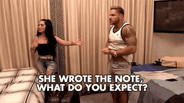 a man and a woman are standing next to each other in a room with the words she wrote the note what do you expect ..