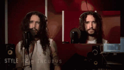 a man with long hair is singing into a microphone with the words style # 2 incubus behind him