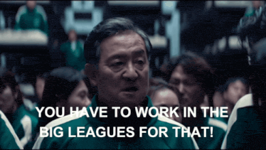 a man stands in front of a group of people and says " you have to work in the big leagues for that "