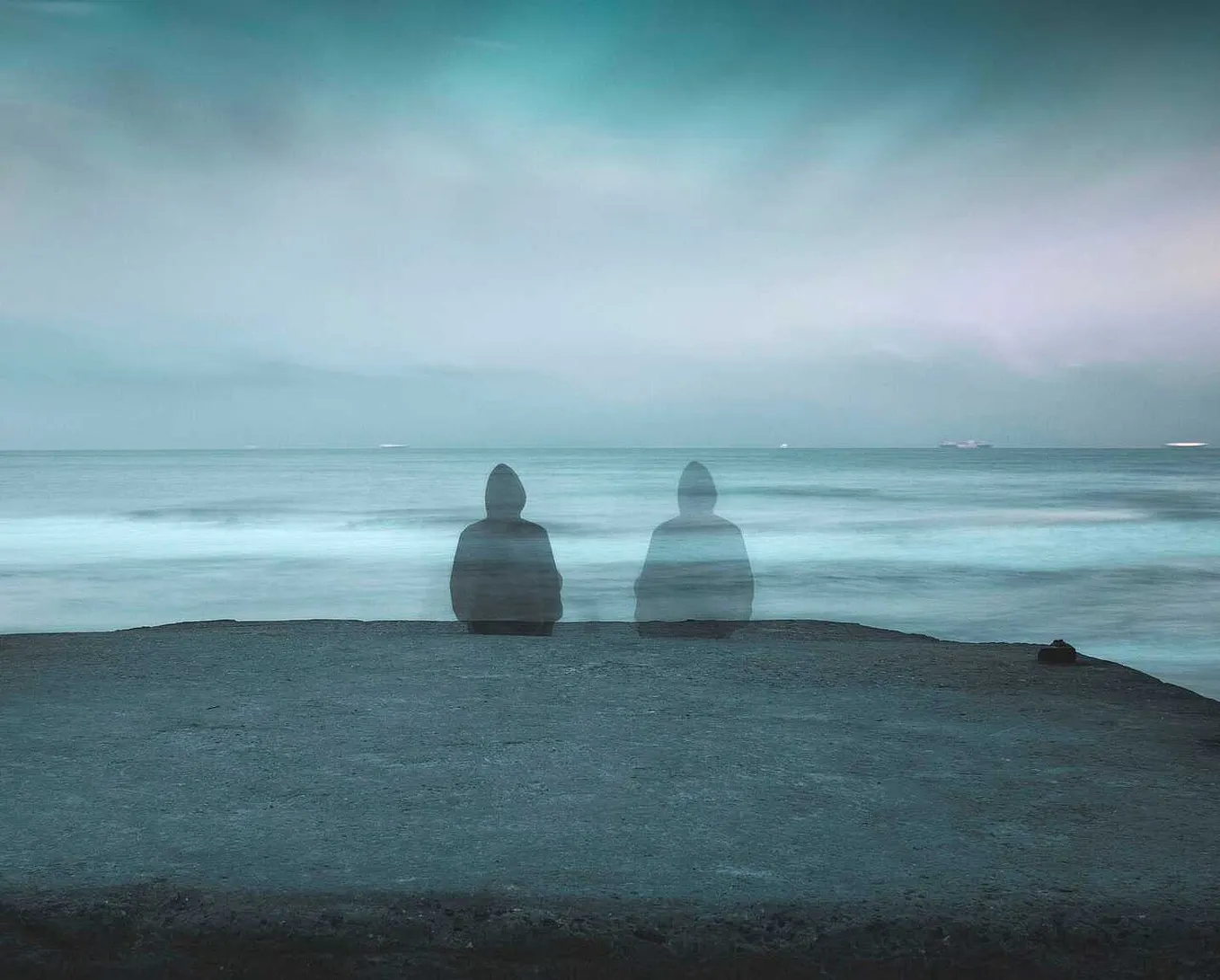 A person fading by the ocean representing loneliness, searching for ways to stop feeling lonely