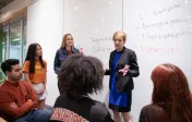 professor teaching at white board
