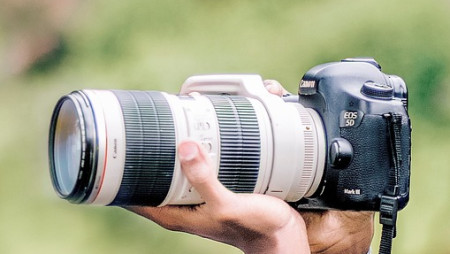 Man holding a camera Man holding a camera