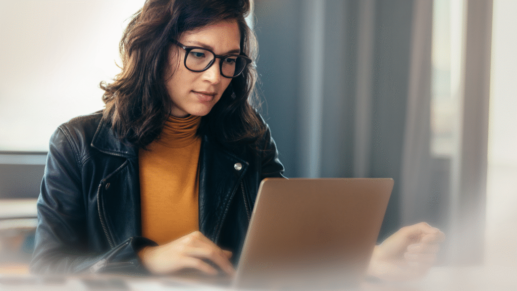 Image of a woman working on her laptop
