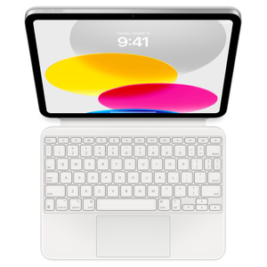 Top-down view showing iPad connected to Magic Keyboard Folio lying flat. Screen displaying colored circular graphics.